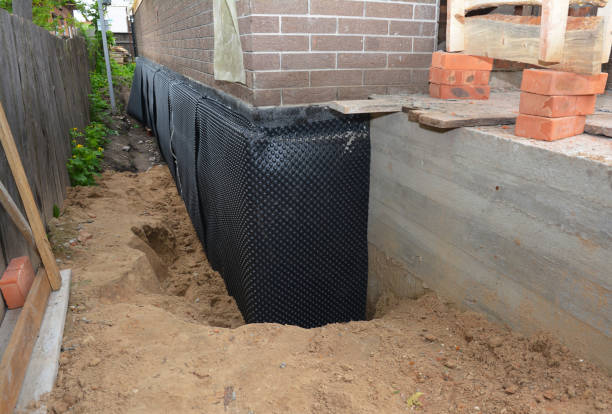 Happy homeowners after waterproofing job in Zenda